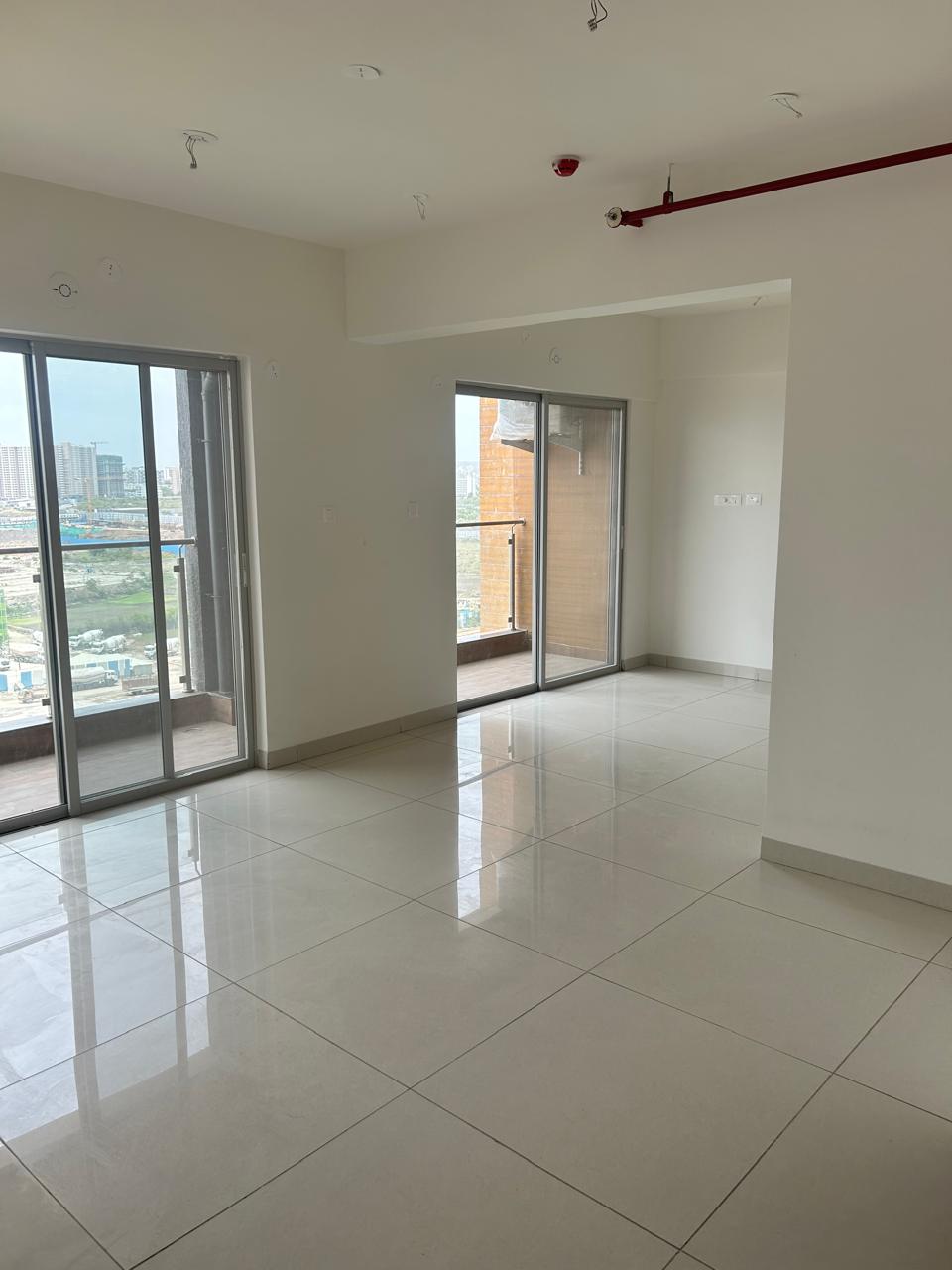 A brand-new, unfurnished 3.5 BHK flat is available for rent in Gera Planet of Joy, Kharadi. - Image 1